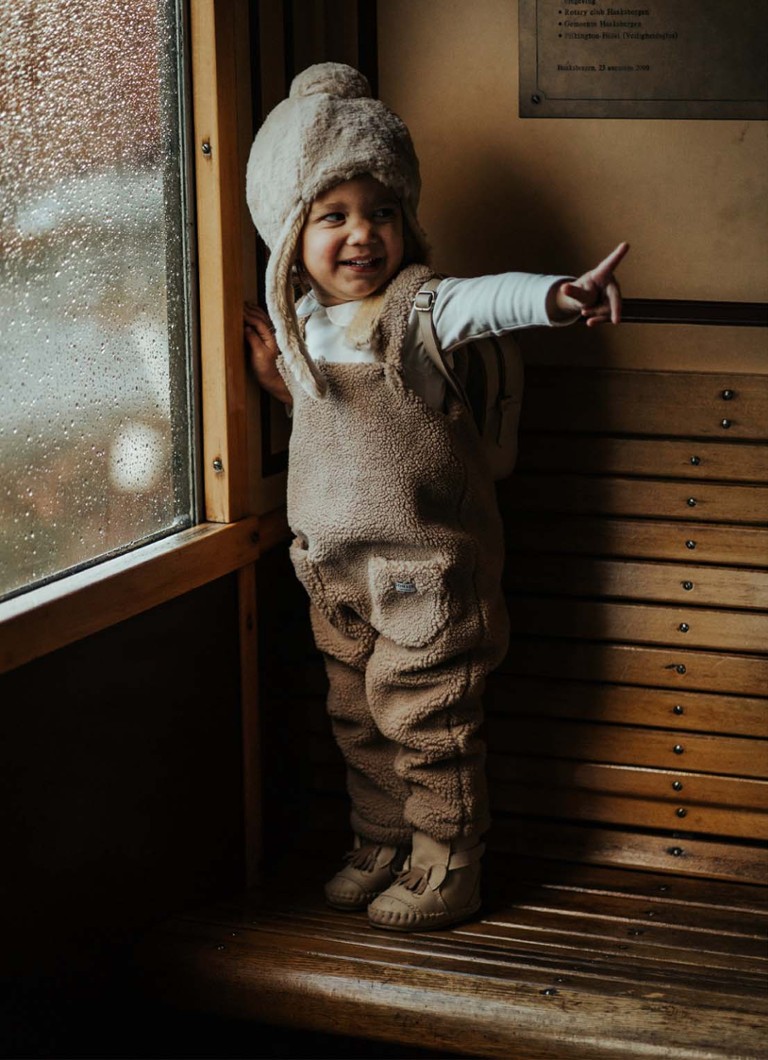 Donsje Amsterdam  Malur babypak van teddy met opgestikte zakken