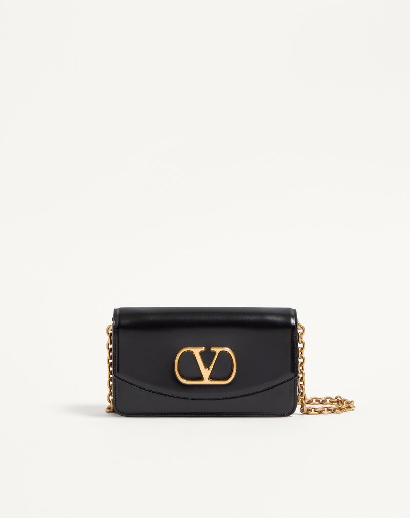 Clutch Vain da Valentino Garavani em couro de bezerro brilhante