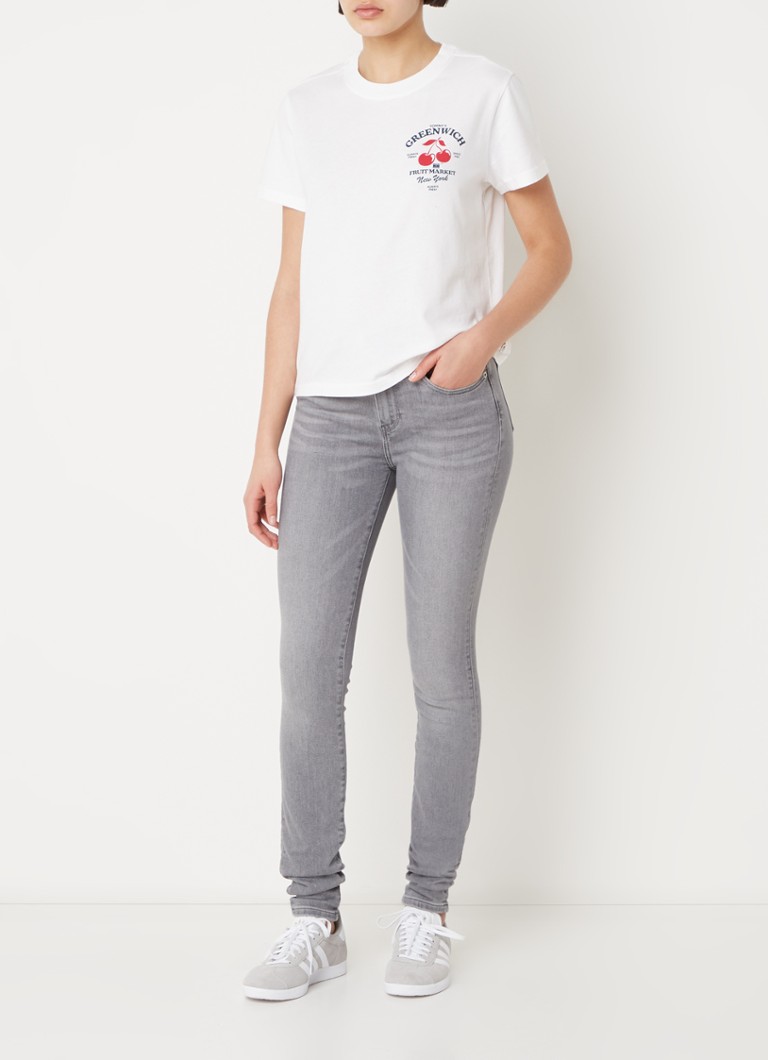 Úzke džínsy Tommy Hilfiger so stredným pásom z lyocellu s farebným praním