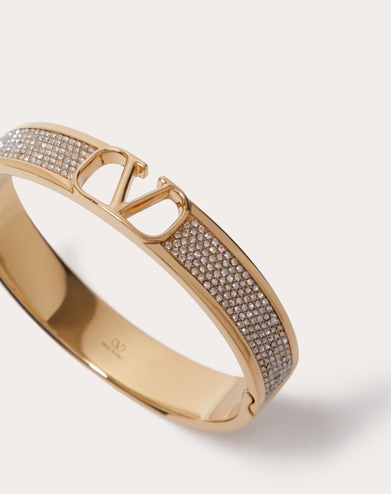 PULSEIRA DE ASSINATURA VLOGO EM METAL E CRISTAIS SWAROVSKI®