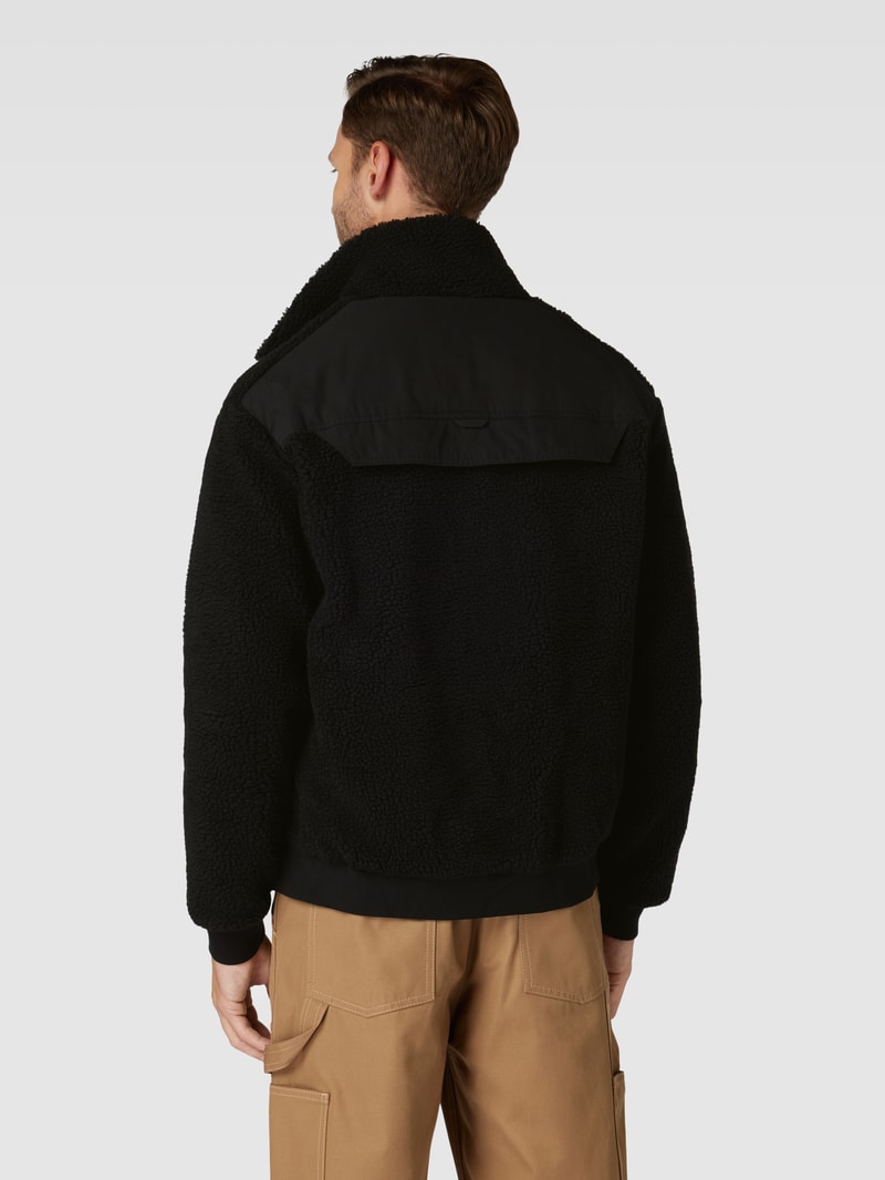 Jacke mit Stehkragen und Brusttaschen in schwarz
