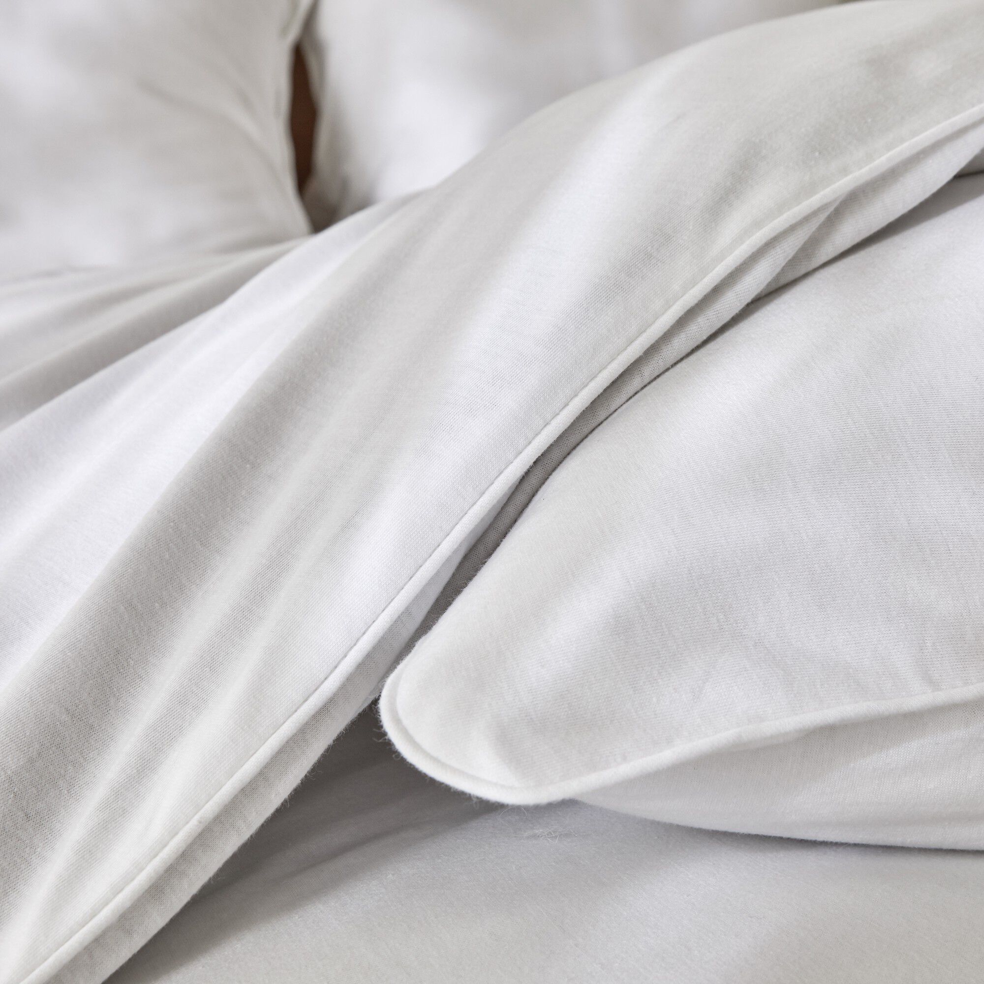Linge de lit uni en jersey passepoilé coton