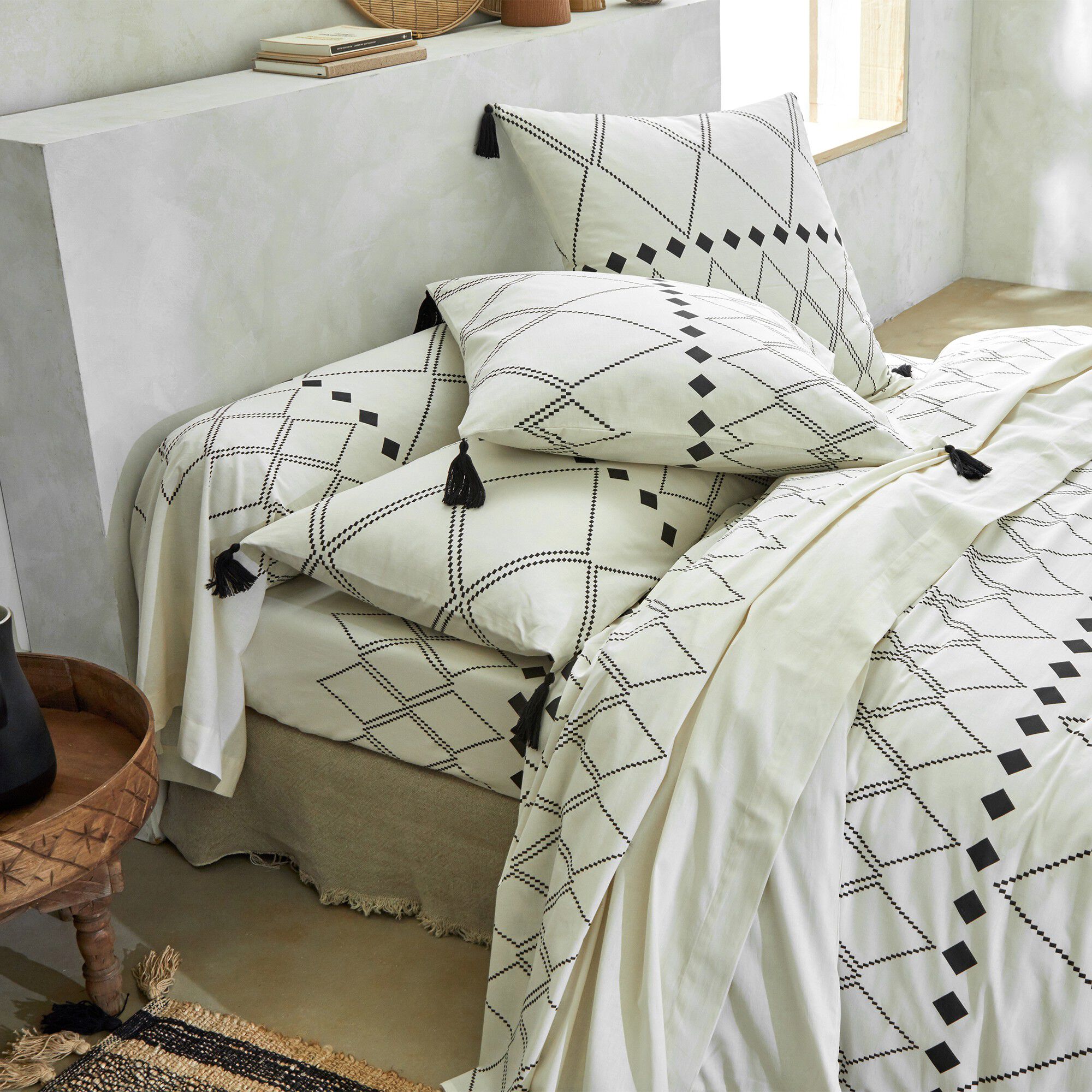 Linge de lit Massaï coton à motifs graphiques et finitions pompons