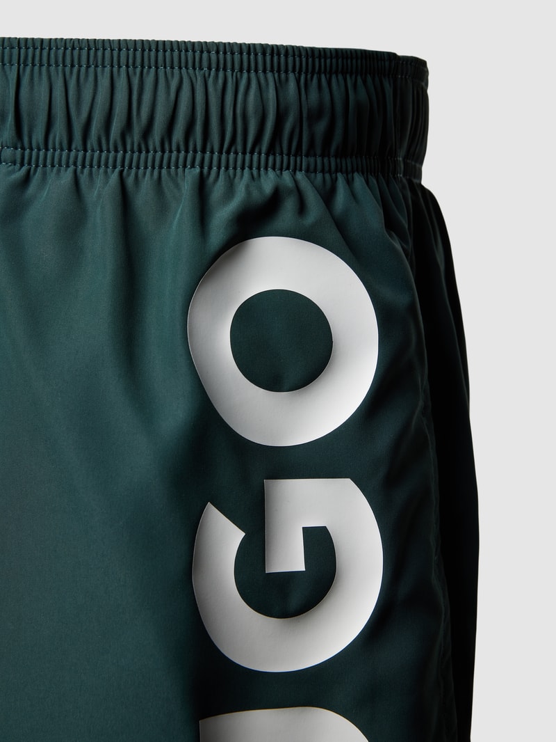 Badehose mit Label-Print Modell 'ABAS' in bottle