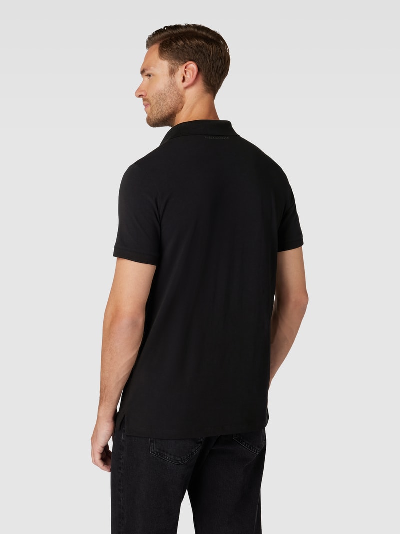 Poloshirt mit Motiv-Patch in schwarz
