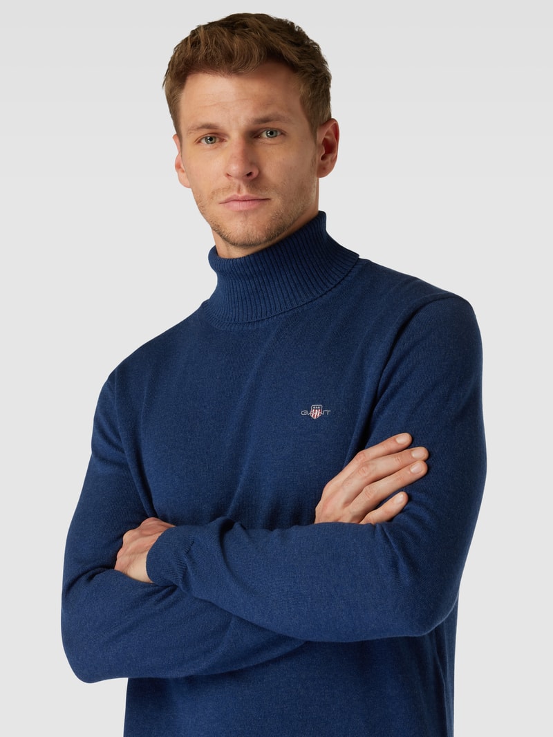 Rollkragenpullover mit Label-Stitching aus Baumwoll-Woll-Mix in marineblau meliert
