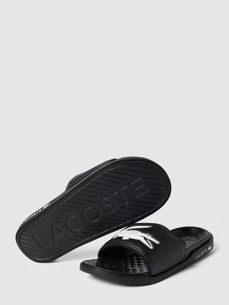 Slides mit Label-Applikation Modell 'Croco Dualiste' in schwarz