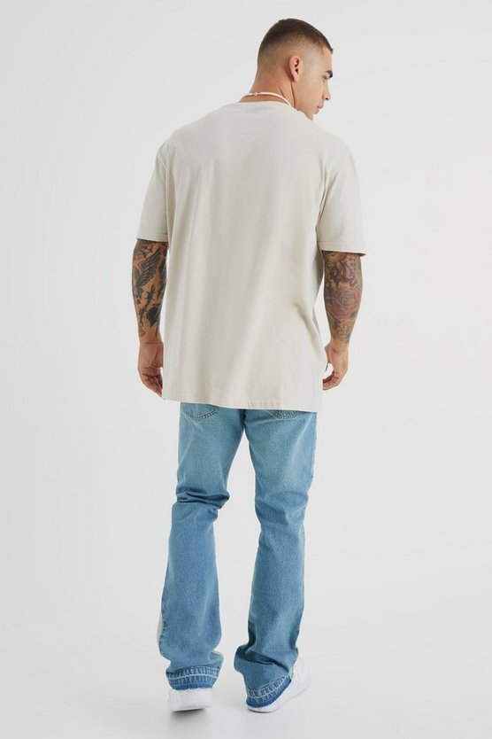 Slim-Fit Schlagjeans mit Applikation