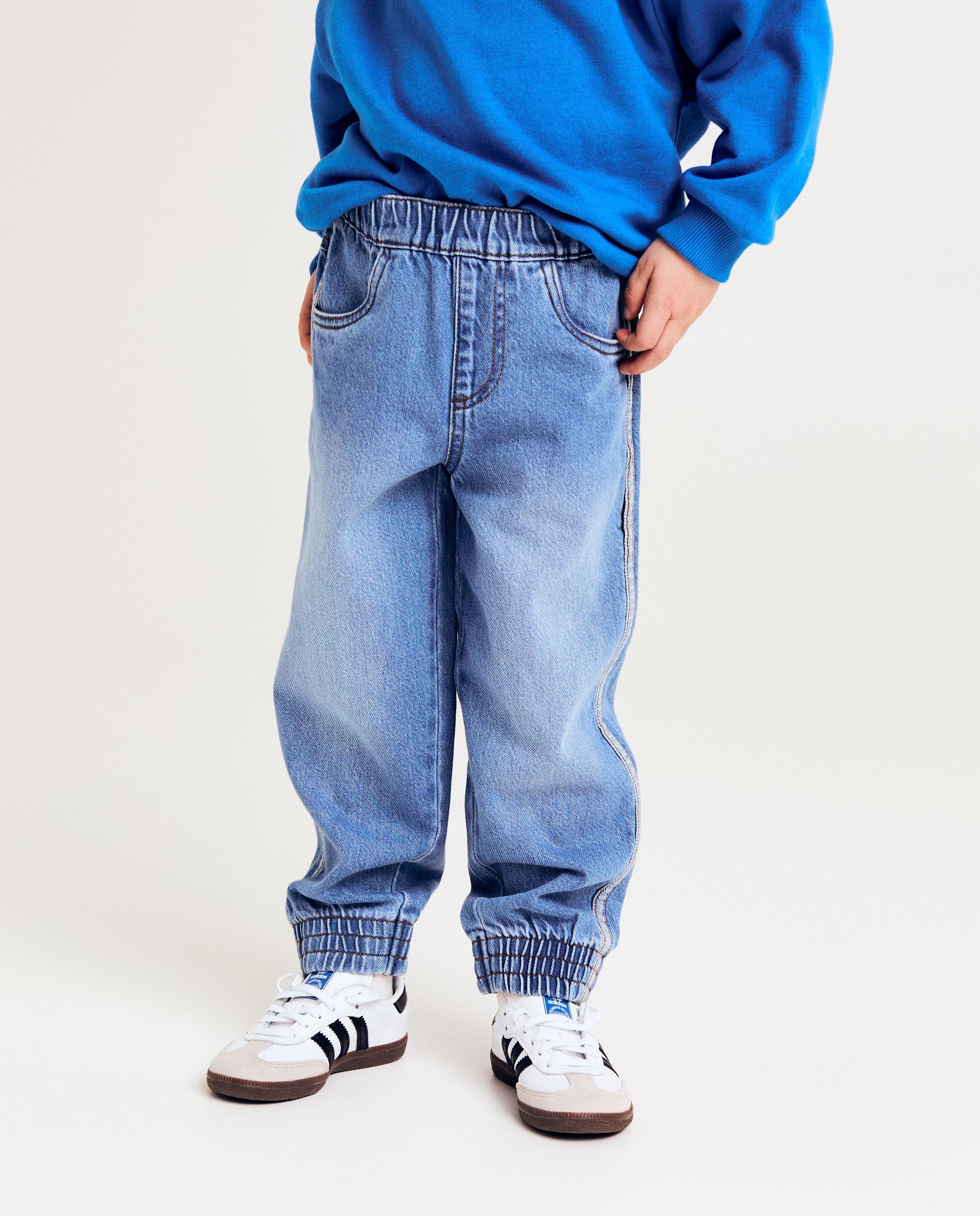 Blugi Kidz Nation cu garnitură, croială baggy, albastru deschis