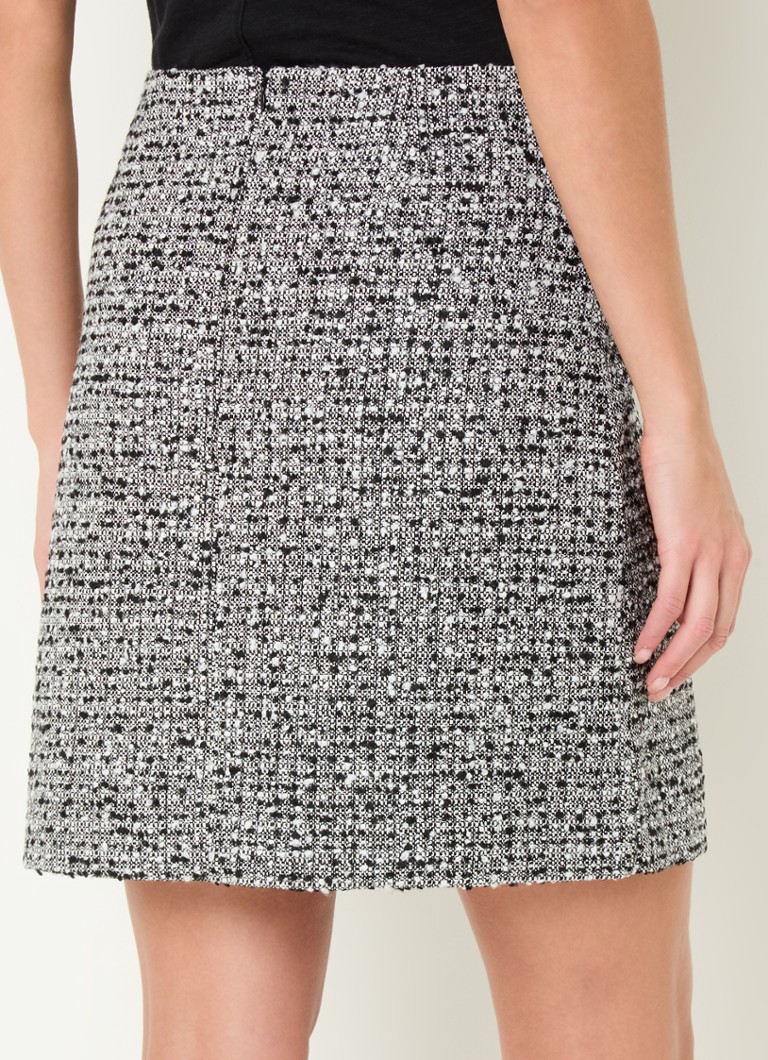 Minissaia Charlie da LKBennett com estampa tweed.