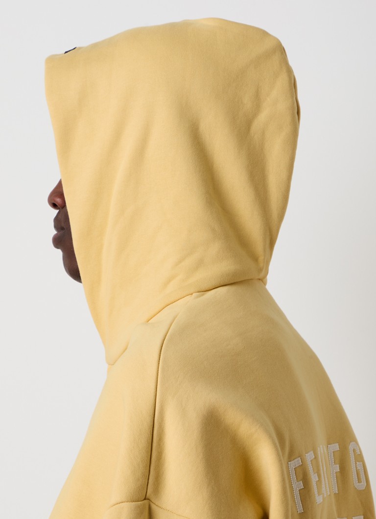 Dukserica Fear of God Essentials s printom na leđima i kapuljačom