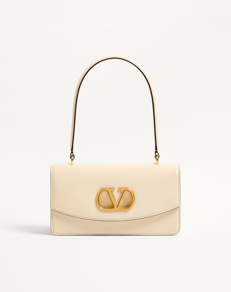 Bolsa Valentino Garavani Vain em couro de bezerro brilhante com alça.