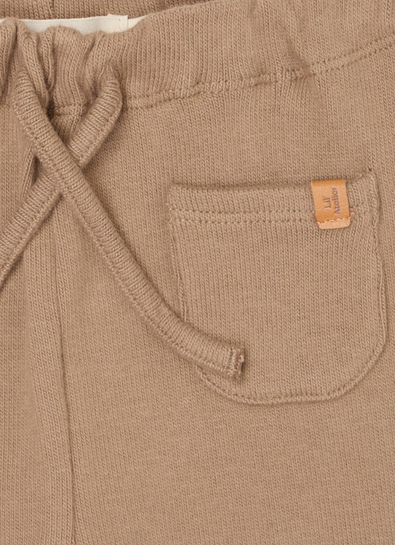 Pantaloni pentru bebeluși Lil' Atelier NBMThoro, mulați, confecționați din bumbac organic.