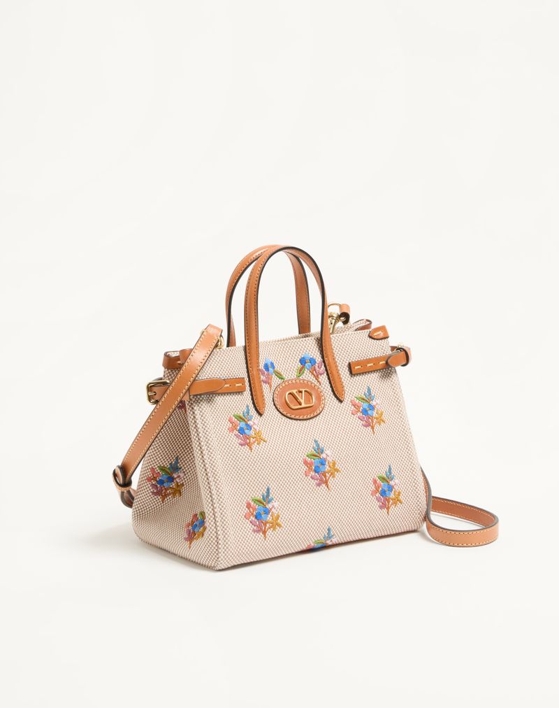 Sacola de compras pequena Valentino Garavani Antibes em lona com bordado.