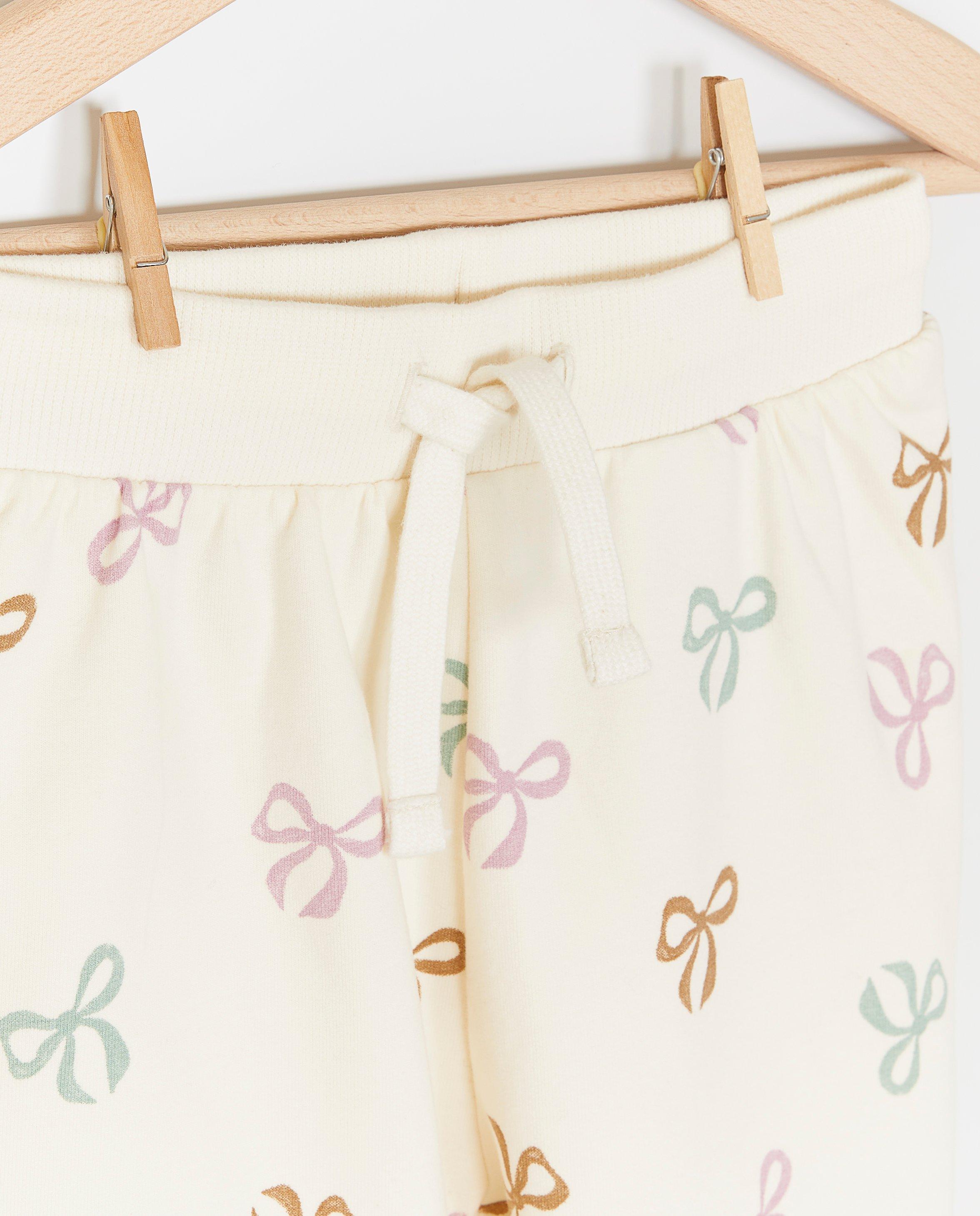 Pantaloni jogging Cuddles and Smiles cu imprimeu de funde albi