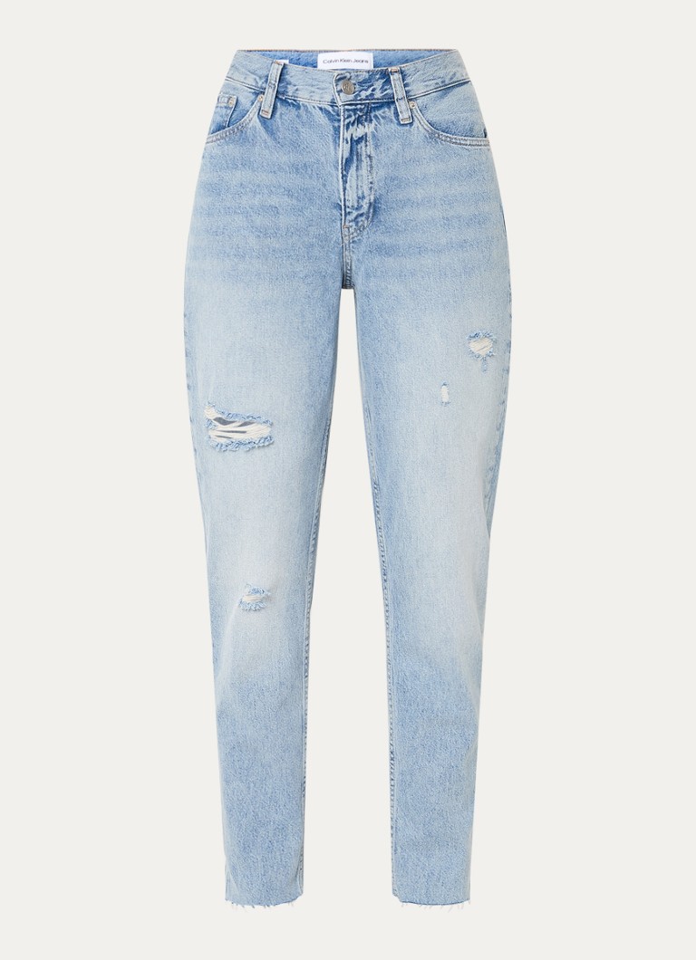 Calvin Klein high-waist mom jeans with a light wash and destroyed finish