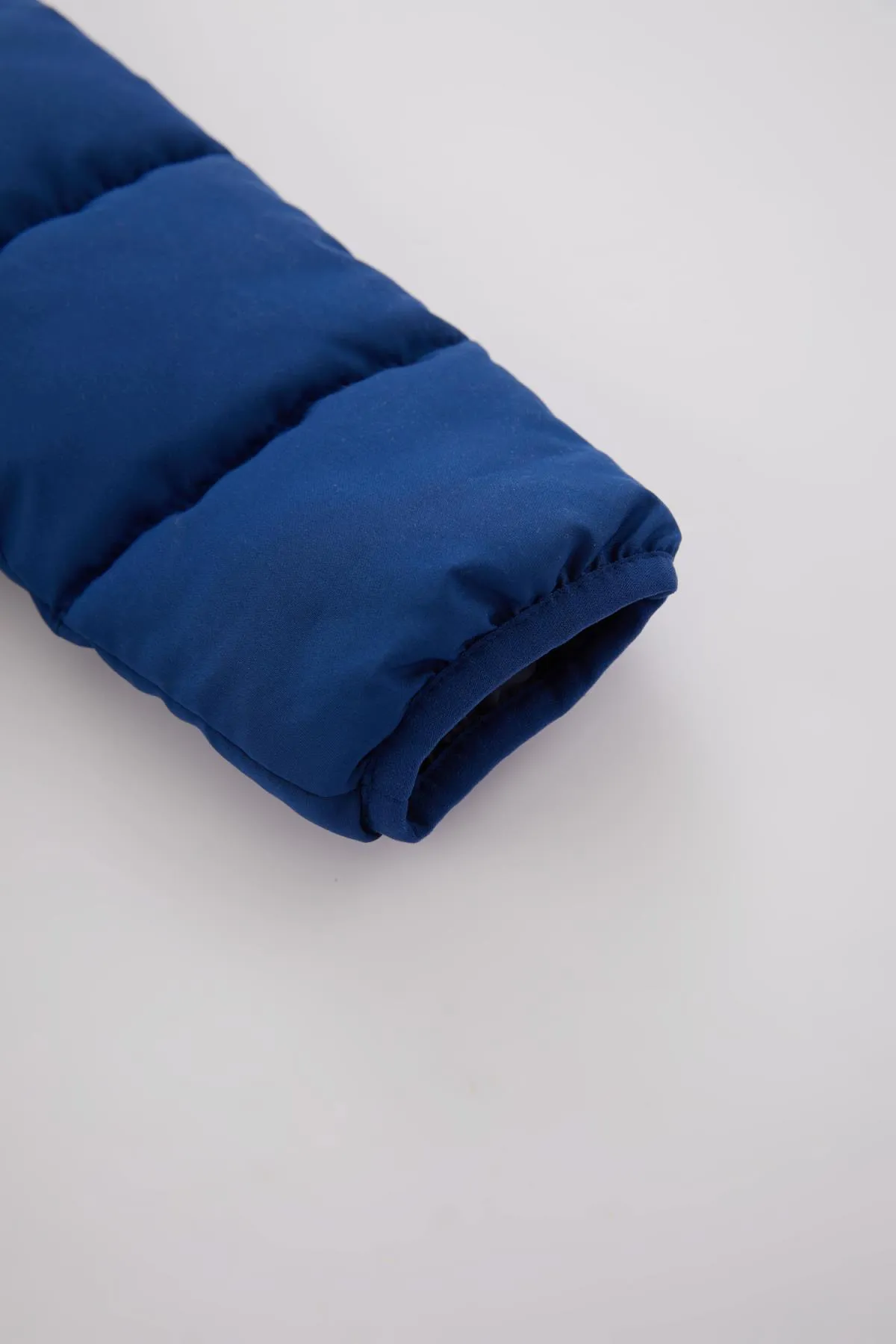 DeFacto  Wasserabweisender, mit Fleece gefütterter Puffermantel für Babys (Jungen).