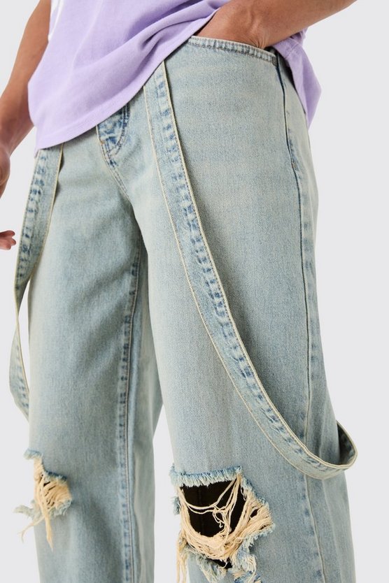 Baggy Rigid Strap Detail Ripped Knee Jeans In Antique Blue