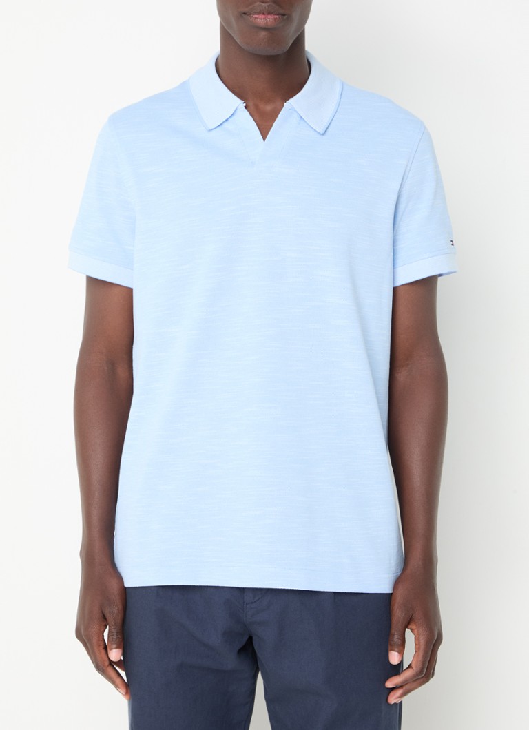 Polo Tommy Hilfiger Mouline de corte regular, confeccionada em algodão piqué.