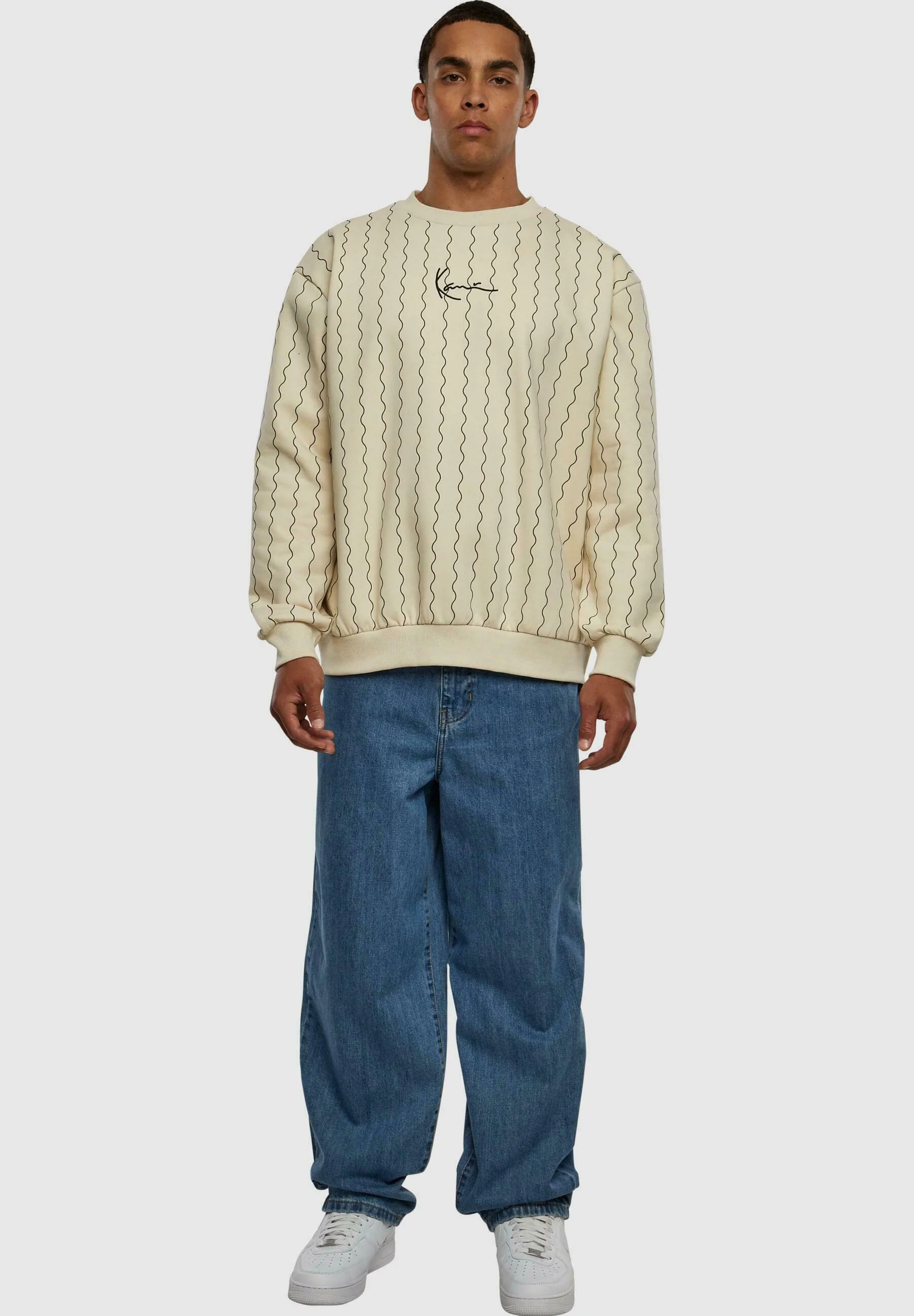 Sudadera Karl Kani con cuello redondo, rayas ziczac y firma pequeña