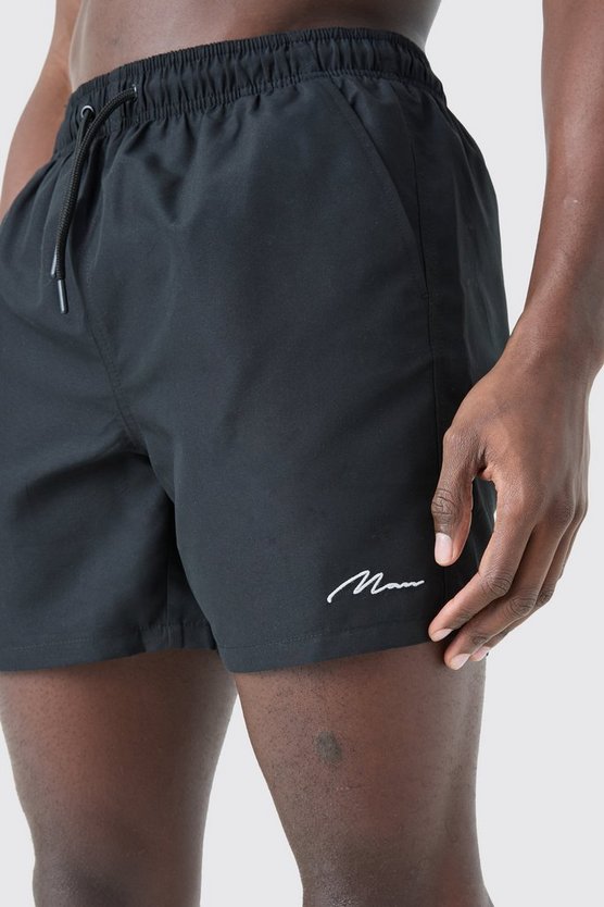 Man Signature mittellange Badehose