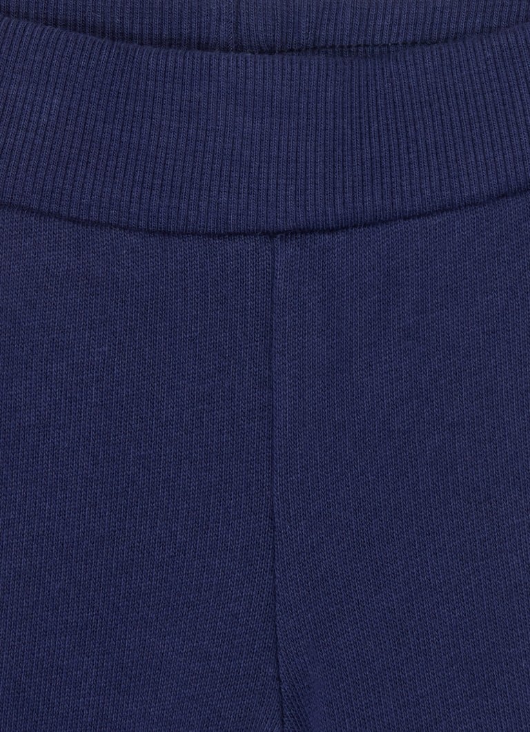 Pantaloni de trening Benetton cu croială conică și broderie.