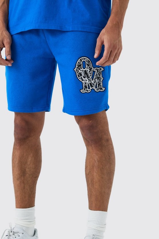 Lockere mittellange Shorts mit Applikation