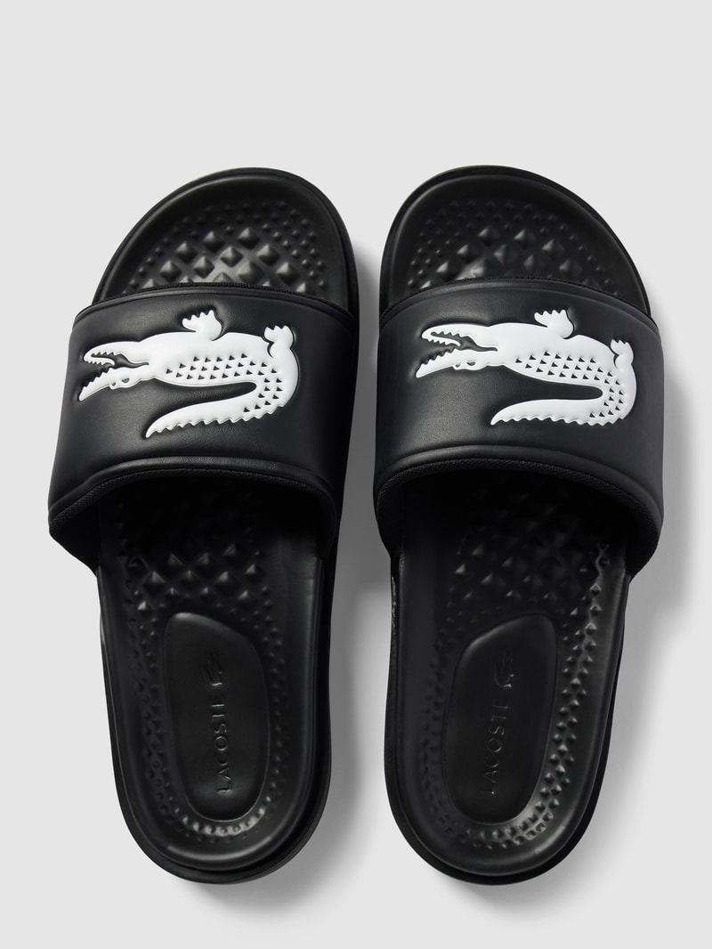 Slides mit Label-Applikation Modell 'Croco Dualiste' in schwarz