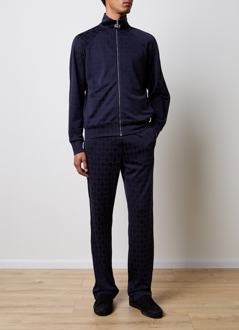 Pantaloni de trening Givenchy cu croială dreaptă, cu logo imprimat și buzunare laterale.