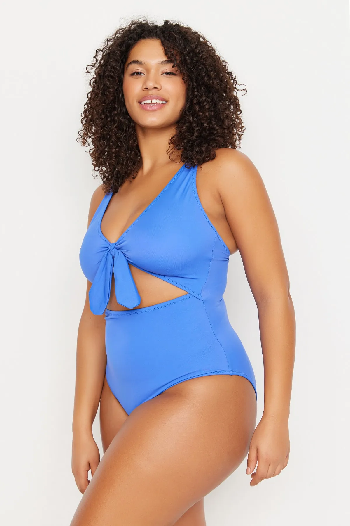 Trendyol Curve  Blauer Badeanzug mit tiefem V-Ausschnitt, Cut-Outs und Bindeband und überzogenem Recovery-Effekt TBBSS22MA0302