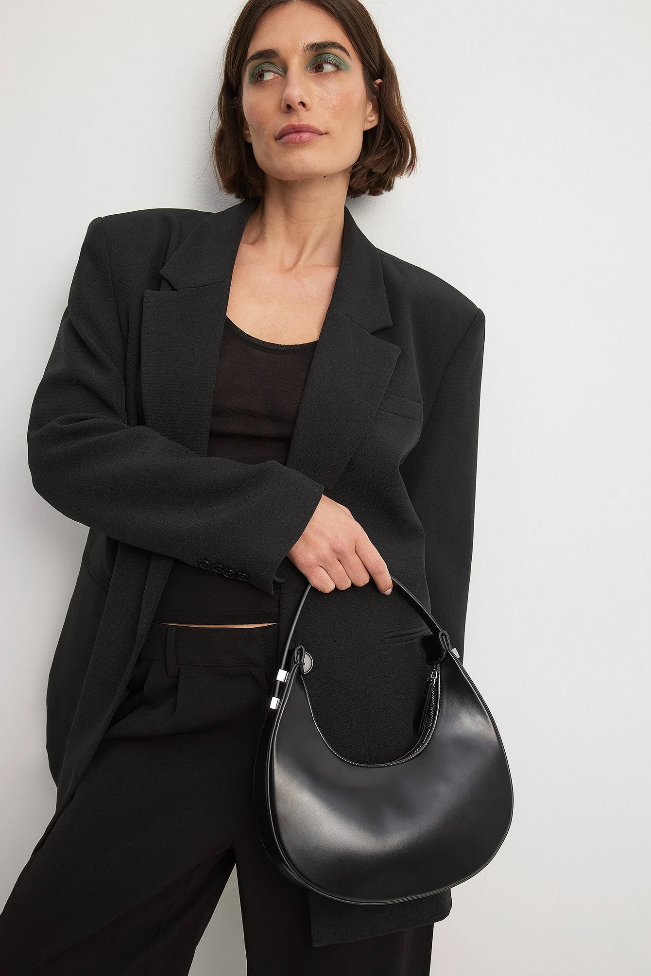 Glänzende abgerundete Tasche