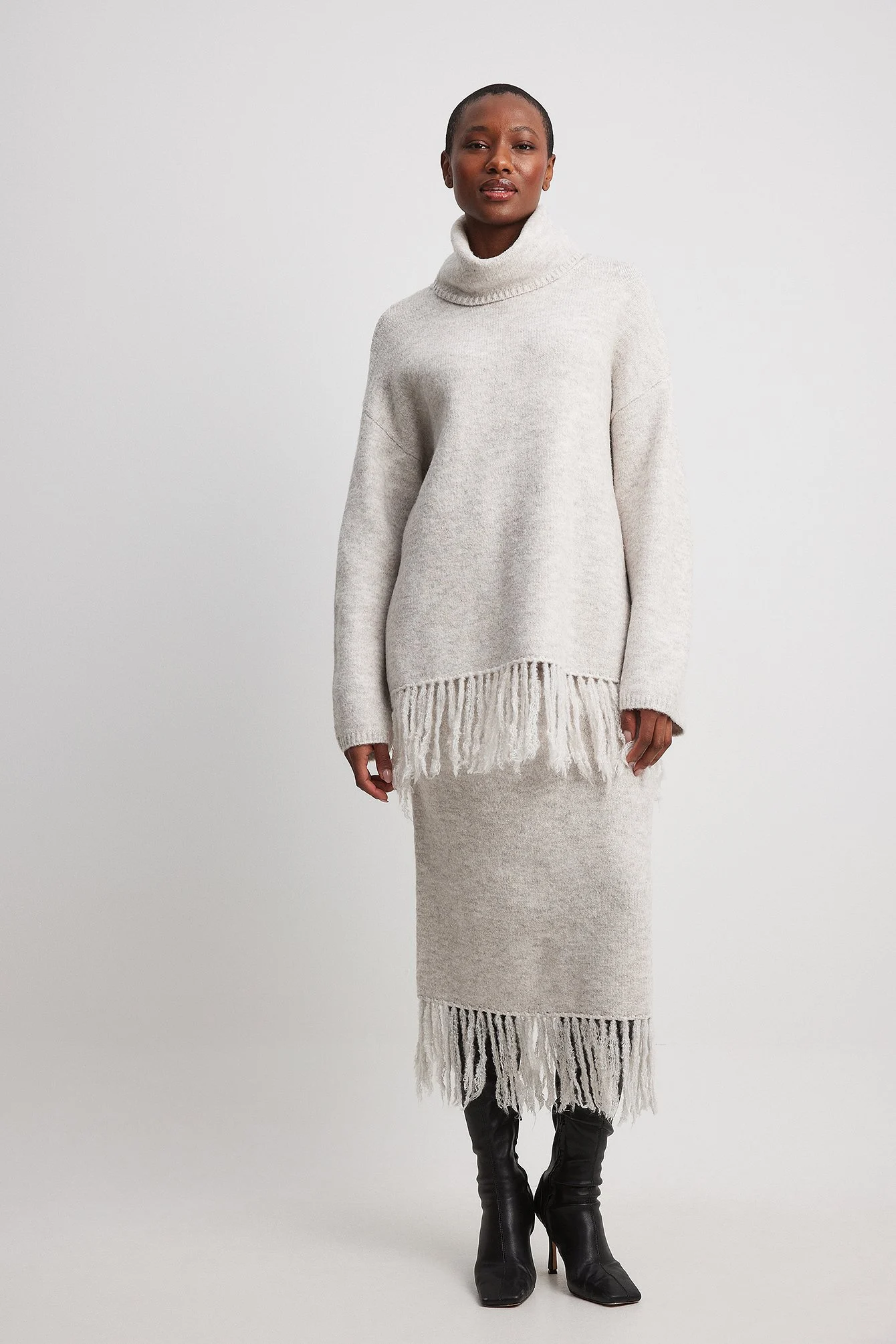 Rollkragenpullover aus Strick mit Fransen