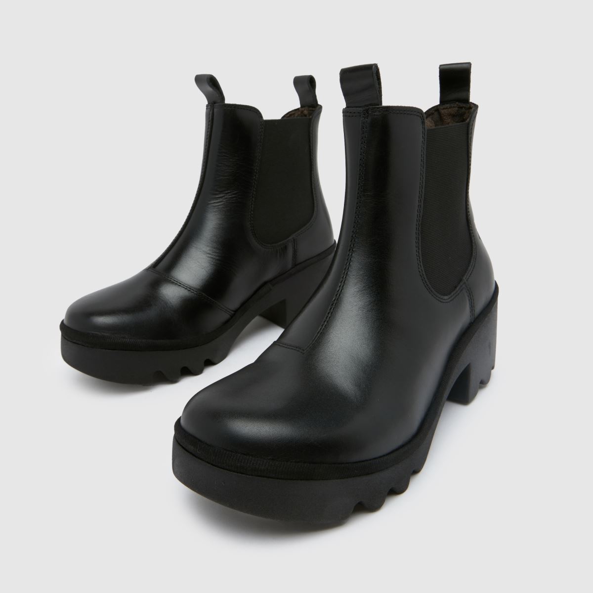 Fly London – Svarta chelseaboots med klack och triangelmönster