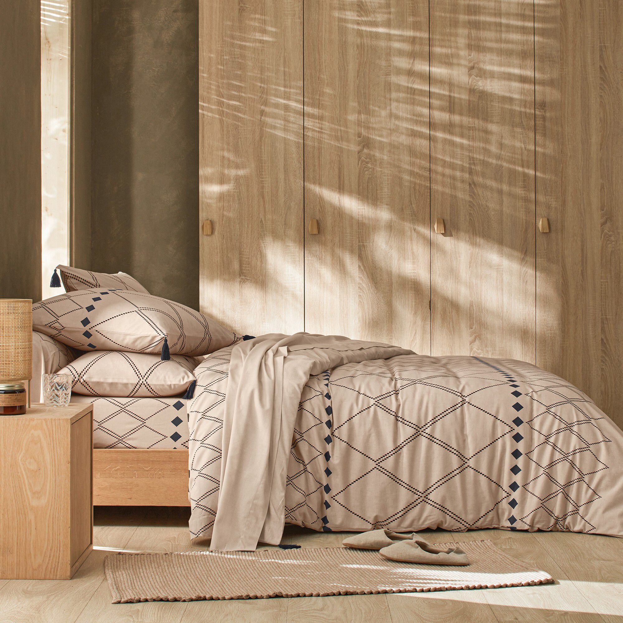 Linge de lit Massaï coton à motifs graphiques et finitions pompons