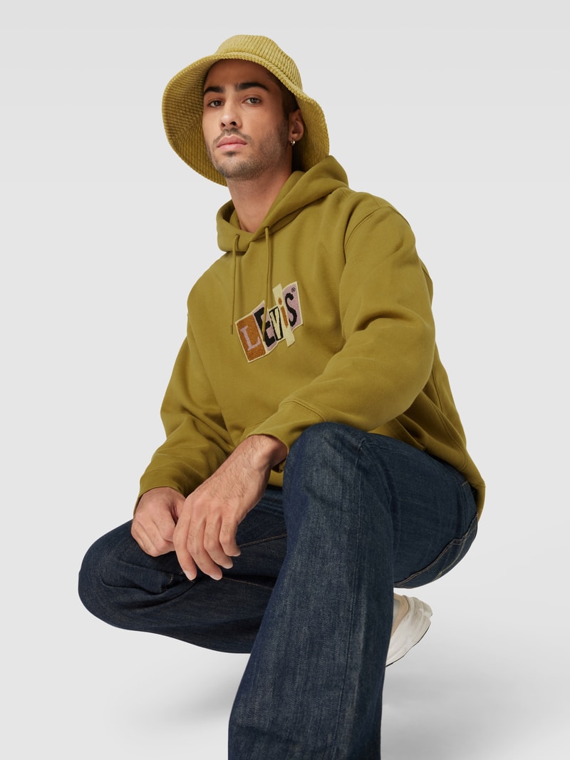 Hoodie mit Label-Patches Modell 'SKATE' in grasgrün