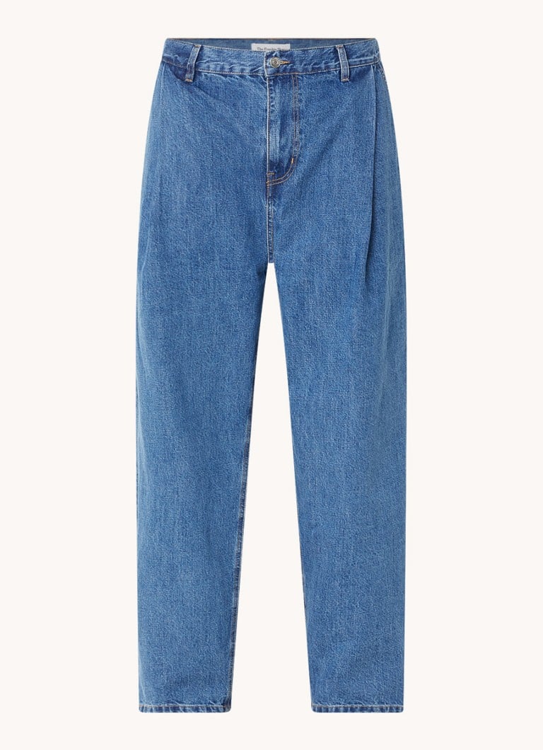 Calça jeans Drew da Frankie Shop, modelagem folgada e lavagem média.