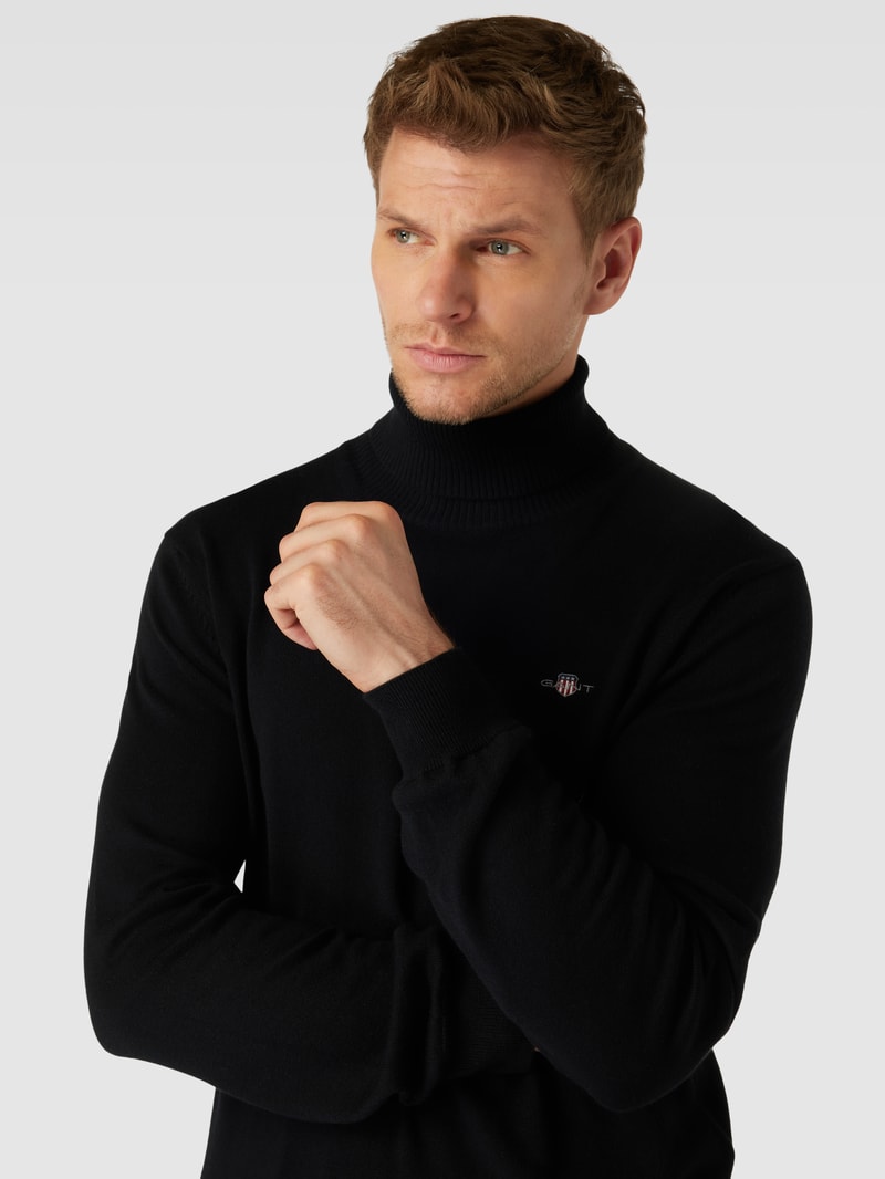 Rollkragenpullover mit Label-Stitching aus Baumwoll-Woll-Mix in schwarz