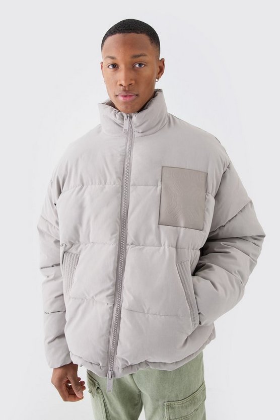 Kastige Oversize Nylon-Steppjacke mit PU-Aufnäher