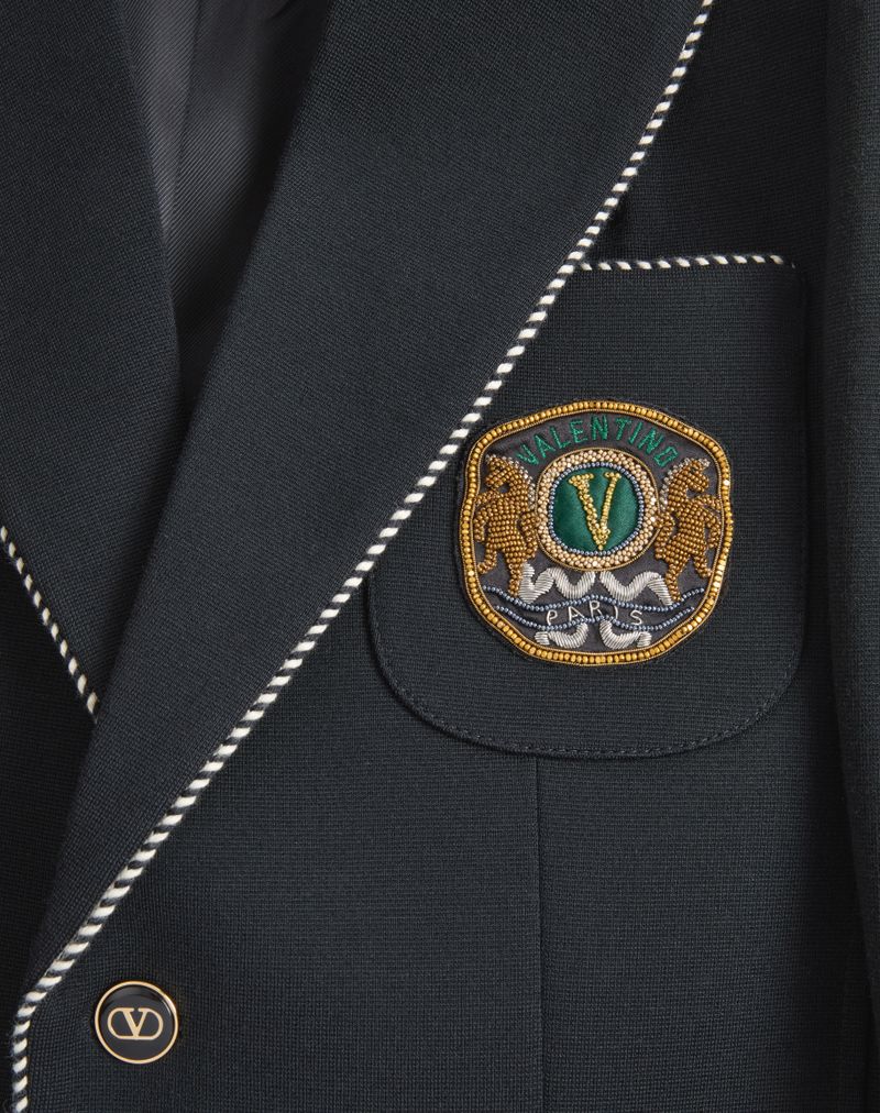 Valentino wollen jas met enkele rij knopen en Valentino-patch