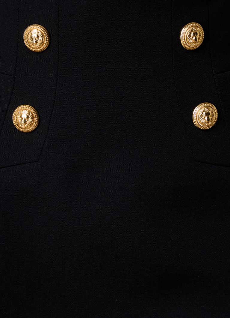 Mini spódniczka Balmain z dziewiczej wełny z ozdobnymi guzikami.
