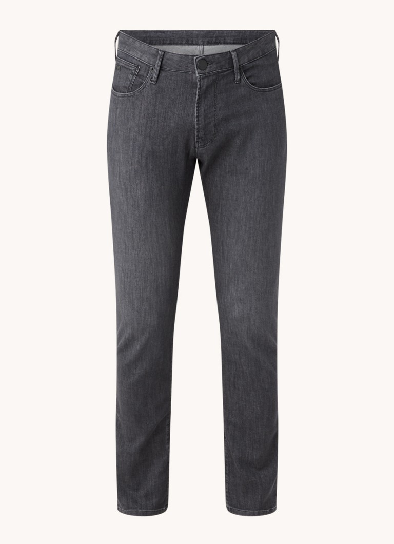 Jeansy o dopasowanym kroju marki Emporio Armani, w ciemnym kolorze, z elastycznego materiału.