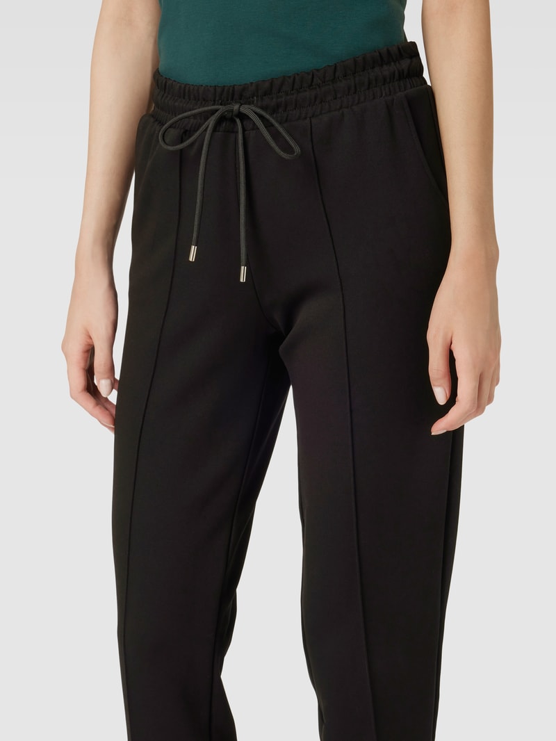 Stoffhose mit Ziernähten in schwarz