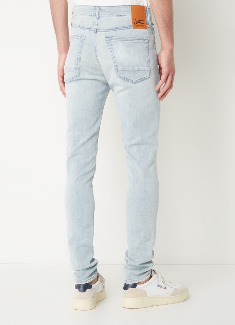Calça jeans skinny Denham Bolt com lavagem clara e bolsos laterais.