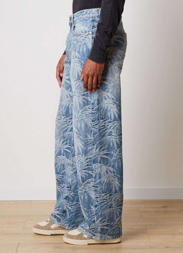 Blugi cu croială largă de la Palm Angels, cu imprimeu tropical.