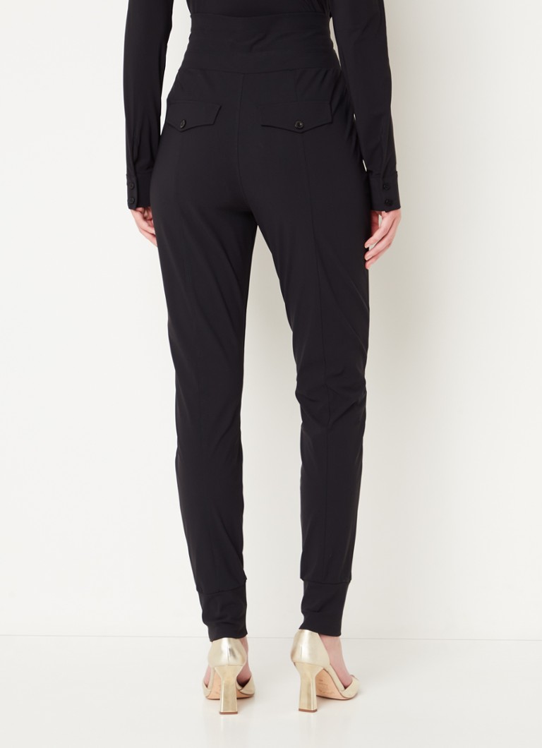 Pantaloni Franka de la Studio Anneloes, cu talie înaltă, croială mulată și buzunare laterale.