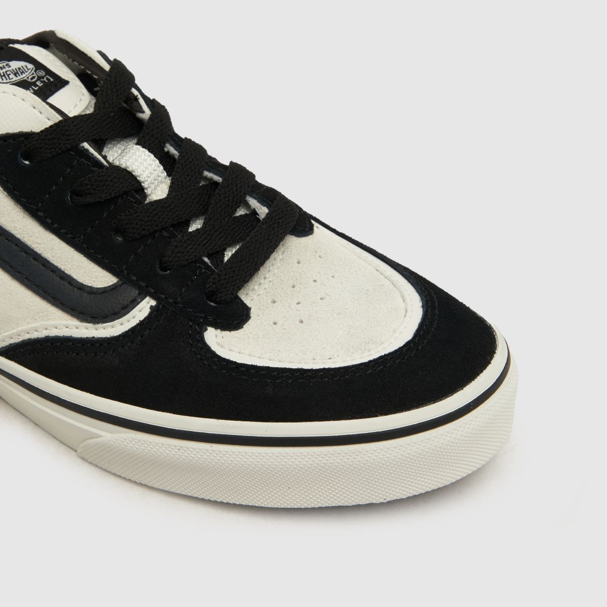 Vans vita och svarta Rowley klassiska ungdomsskor