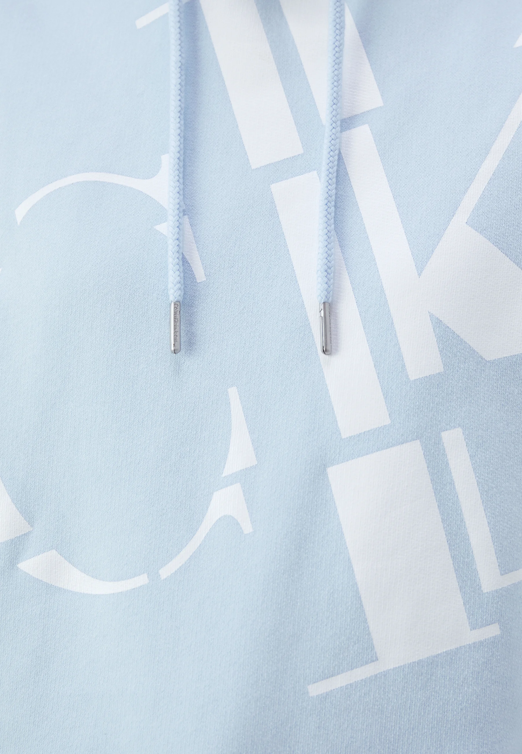 Sudadera con capucha Calvin Klein Jeans Regular con logotipos dispersos, unisex