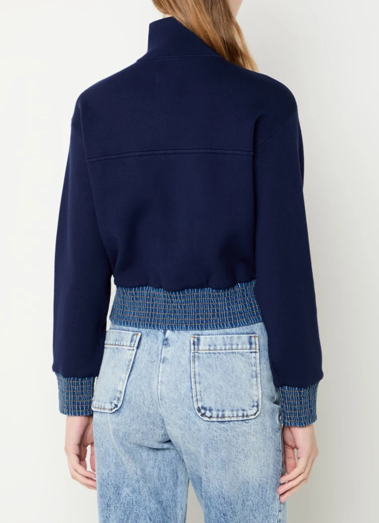 Sandro  Fijngebreid vest met details van denim