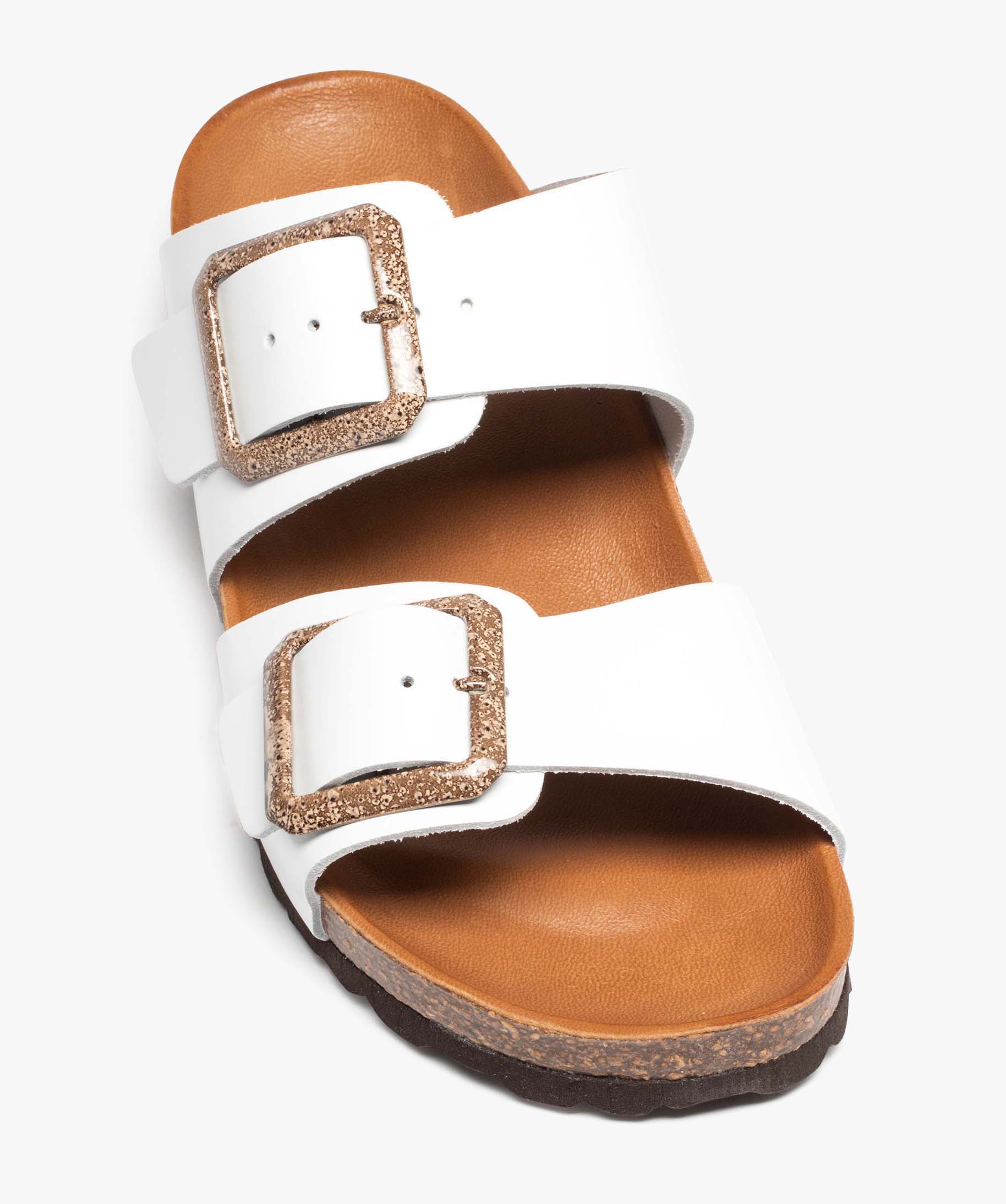 Mules femme unies à larges brides bouclées en cuir blanc | GEMO