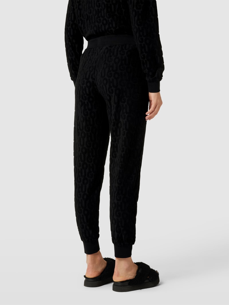 Jogpants mit Allover-Label-Muster aus Frottee Modell 'TERRY ME' in schwarz